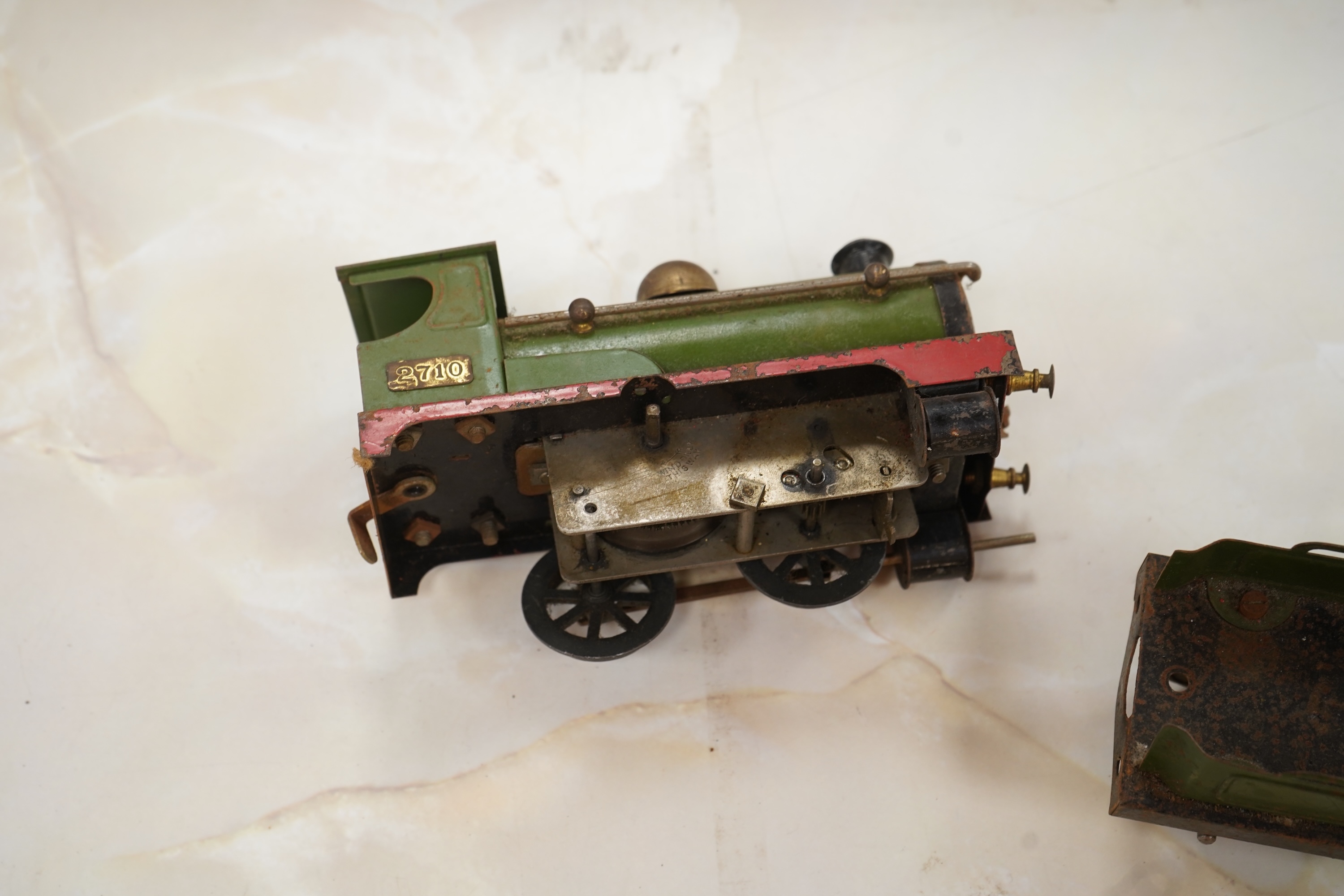 A Bing for Bassett Lowke 0 gauge tinplate clockwork LNER Ivatt 4-4-0 tender locomotive, 4390, together with an early Hornby clockwork 0-4-0, 2710, in GNR green livery with Meccano Ltd roundels to locomotive splasher and